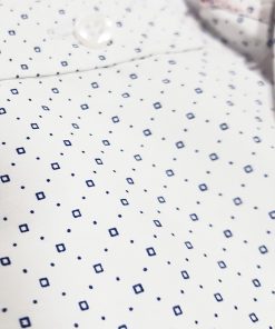 A close-up view of a Men's Slim Fit Casual Shirt in white with a subtle dotted micro print pattern.