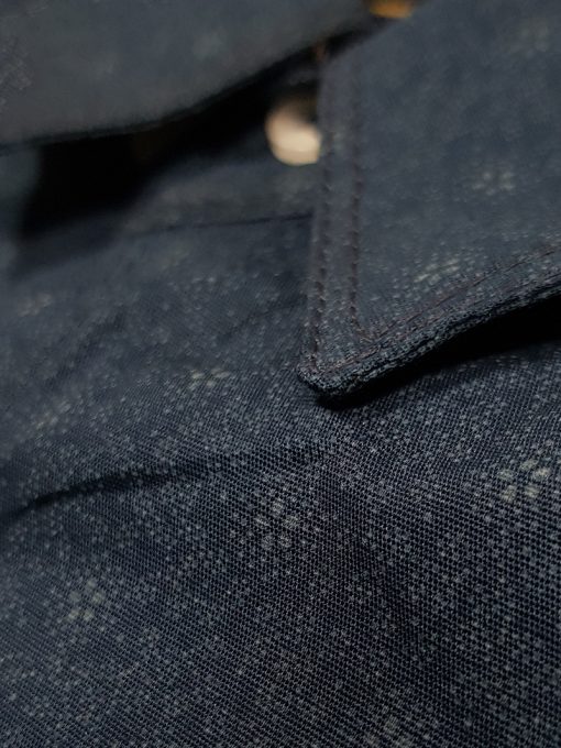 A close-up view of a Men's Slim Fit Casual Shirt in Navy Print